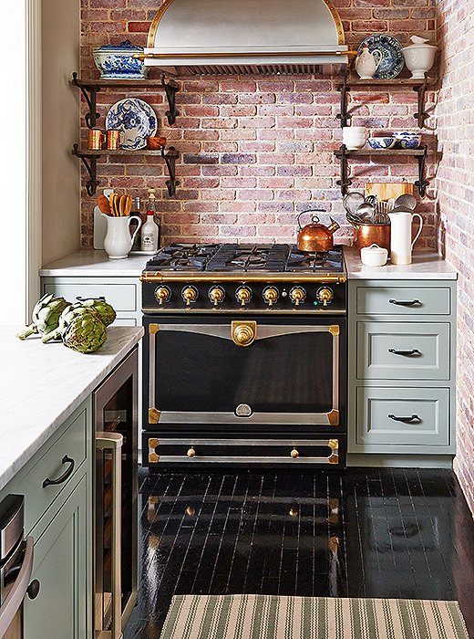 While the La Cornue oven is the star of this kitchen, designer Jenny Wolf had the cabinets painted in Farrow & Ball’s Pigeon to ensure that the appliance didn’t overpower its surroundings: “The whole apartment has an ethereal quality to it with all the natural light and tall ceilings and air. I just wanted to keep it feeling fresh, clean, and calm.” Photo by Tony Vu.

